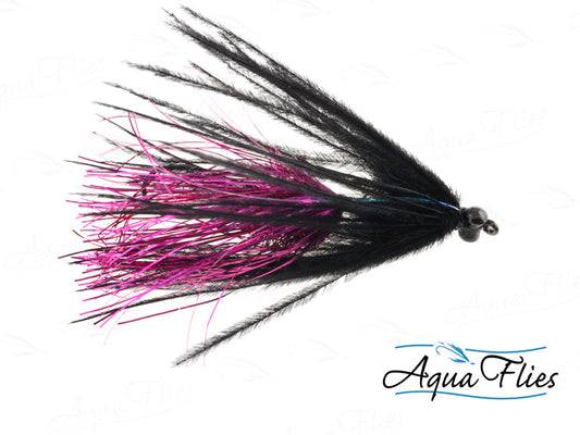 Photo of a Black/Cerise steelhead fly.